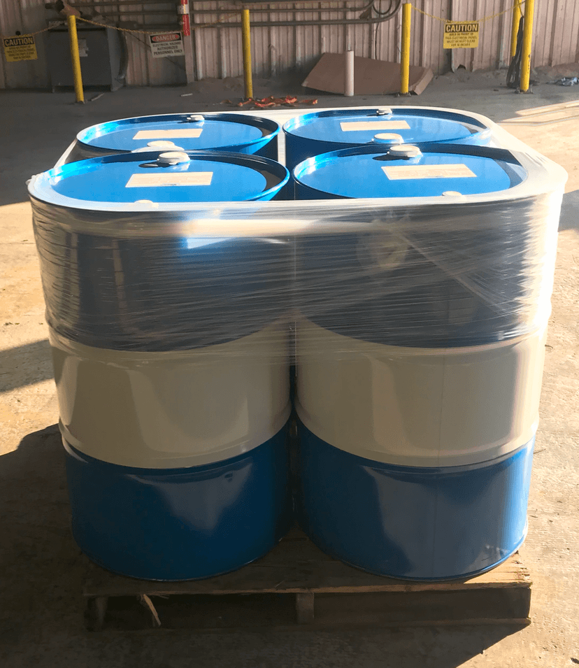 55-gallon oil drums on pallet ready for distribution